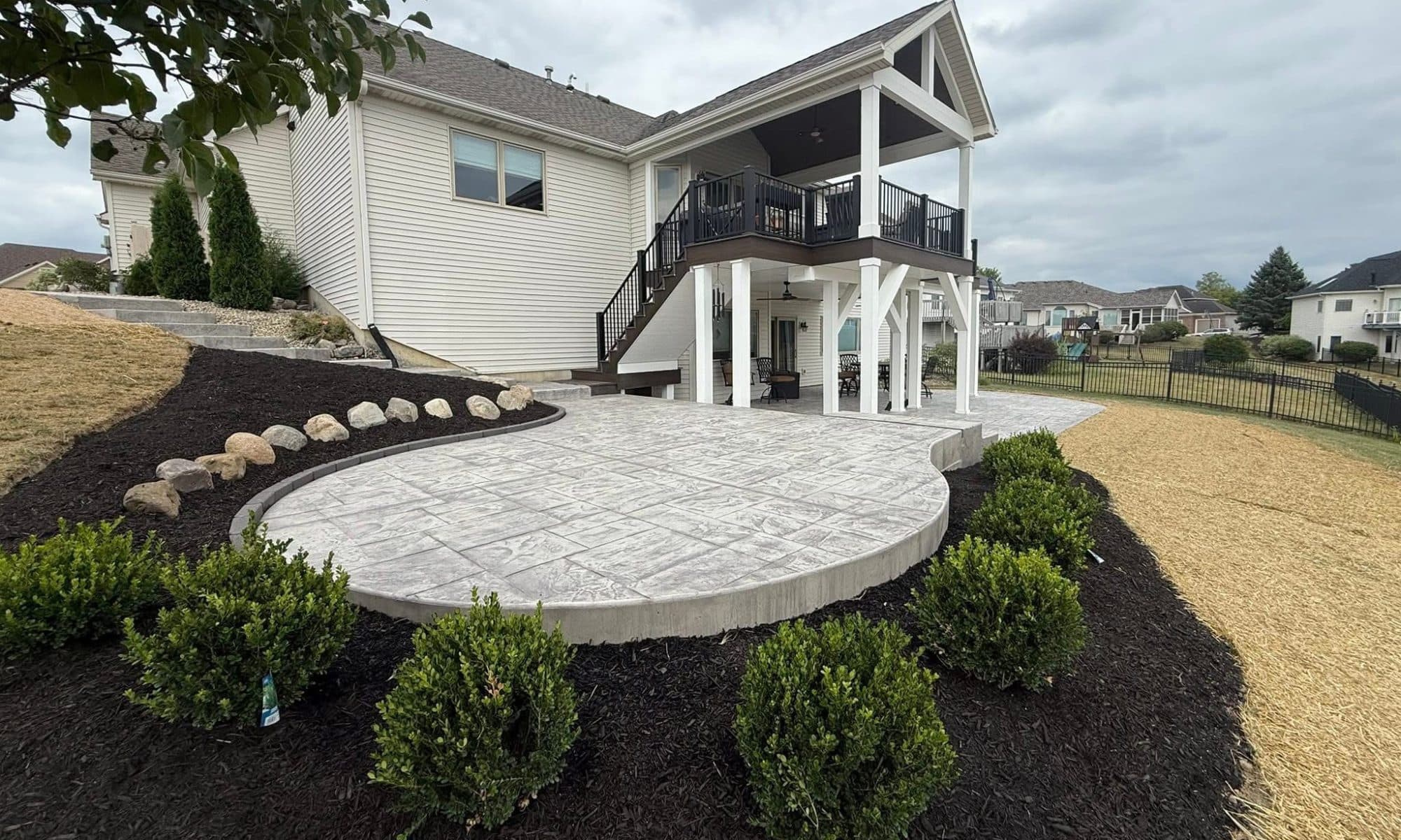 Beautiful stamped concrete patio with house